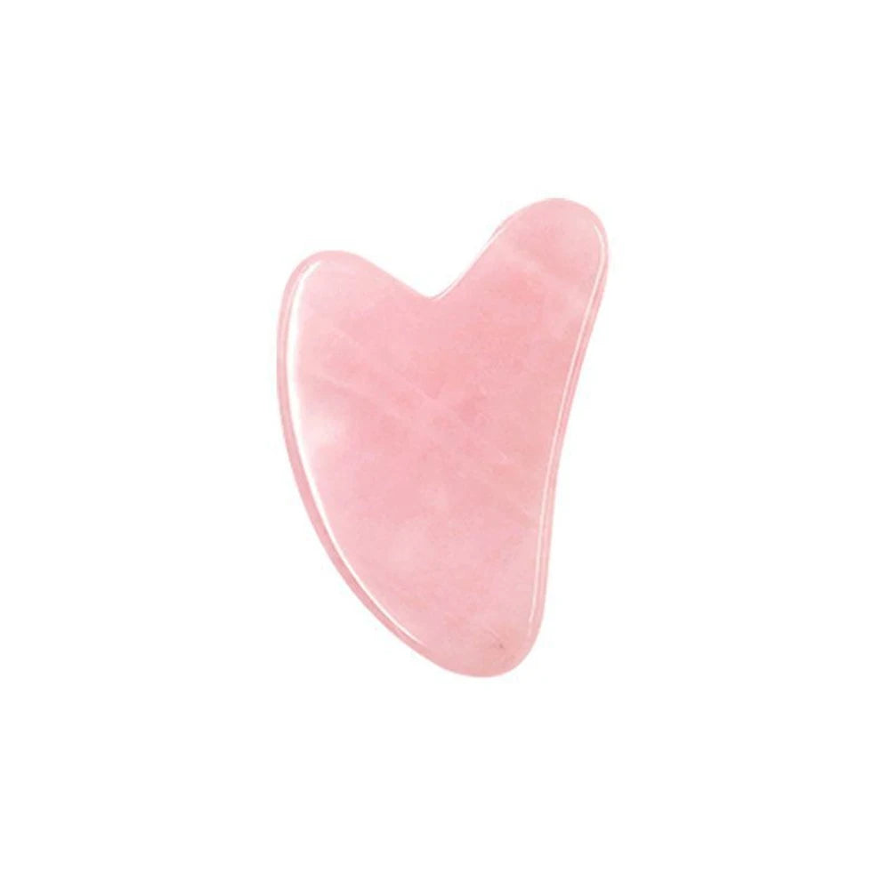 Gua sha de quartzo rosa para massagem facial
